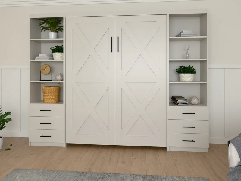 A vertical Barn Door X Murphy bed in Agreeable Gray, closed, between tall side cabinets in a bedroom (rendered)